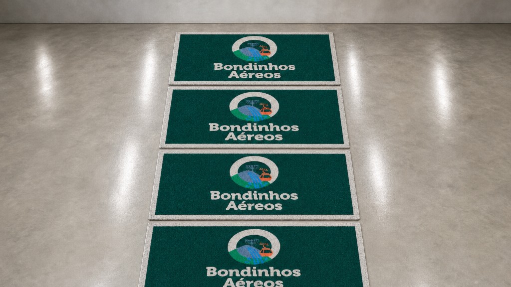 Entrega de tapetes capacho personalizados dos Bondinhos Aéreos empilhados em formato 16:9, mostrando a quantidade do pedido, com acabamento premium e identidade da marca em destaque.